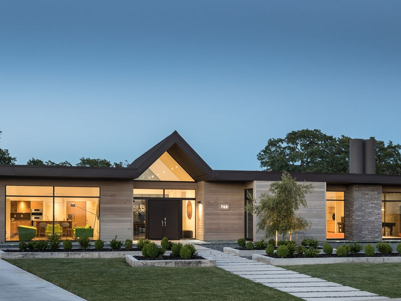 Completed J Palace Construction custom home with modern architecture and full landscape design