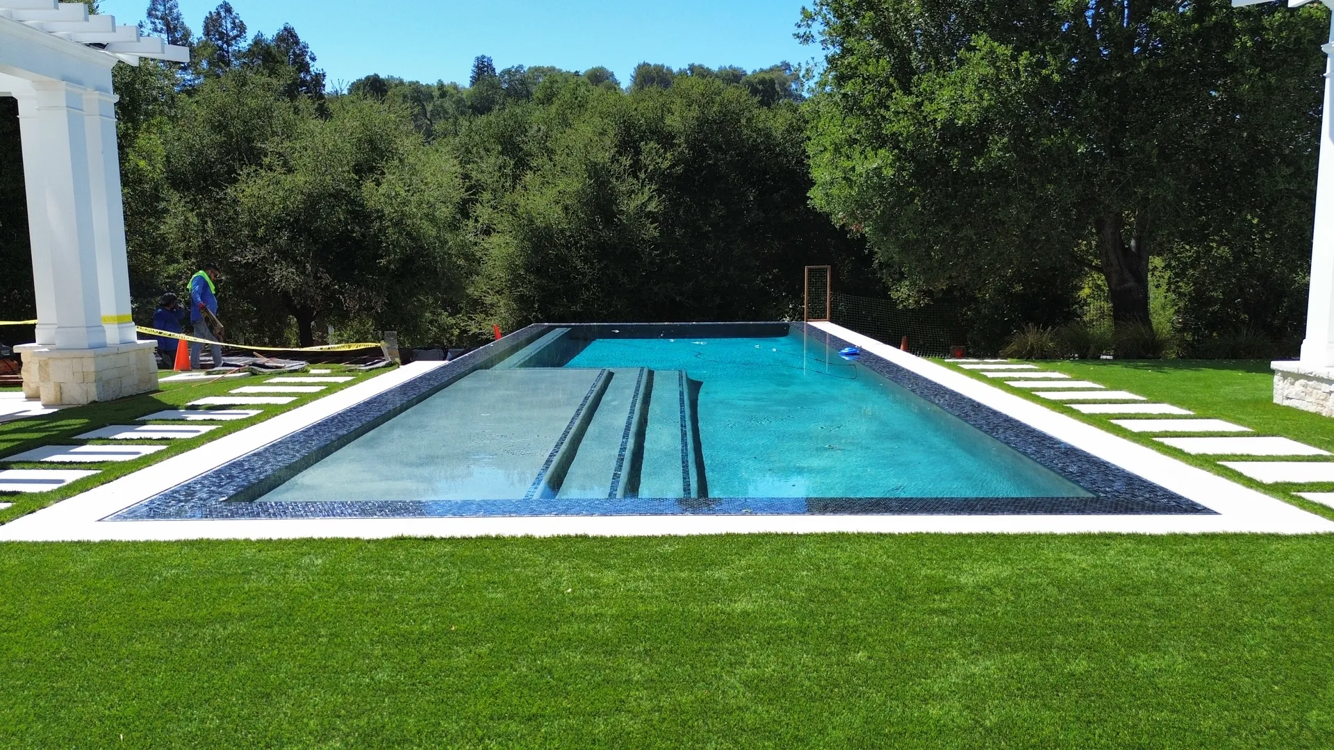 Aerial view of J Palace Construction custom home with pool, pergola, and full landscape design