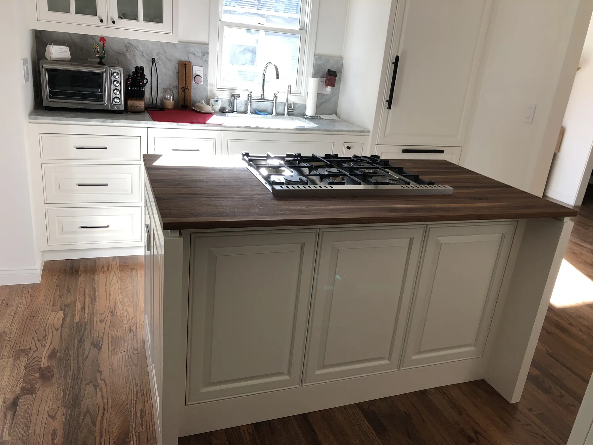 Cream Cabinets With Dark Island