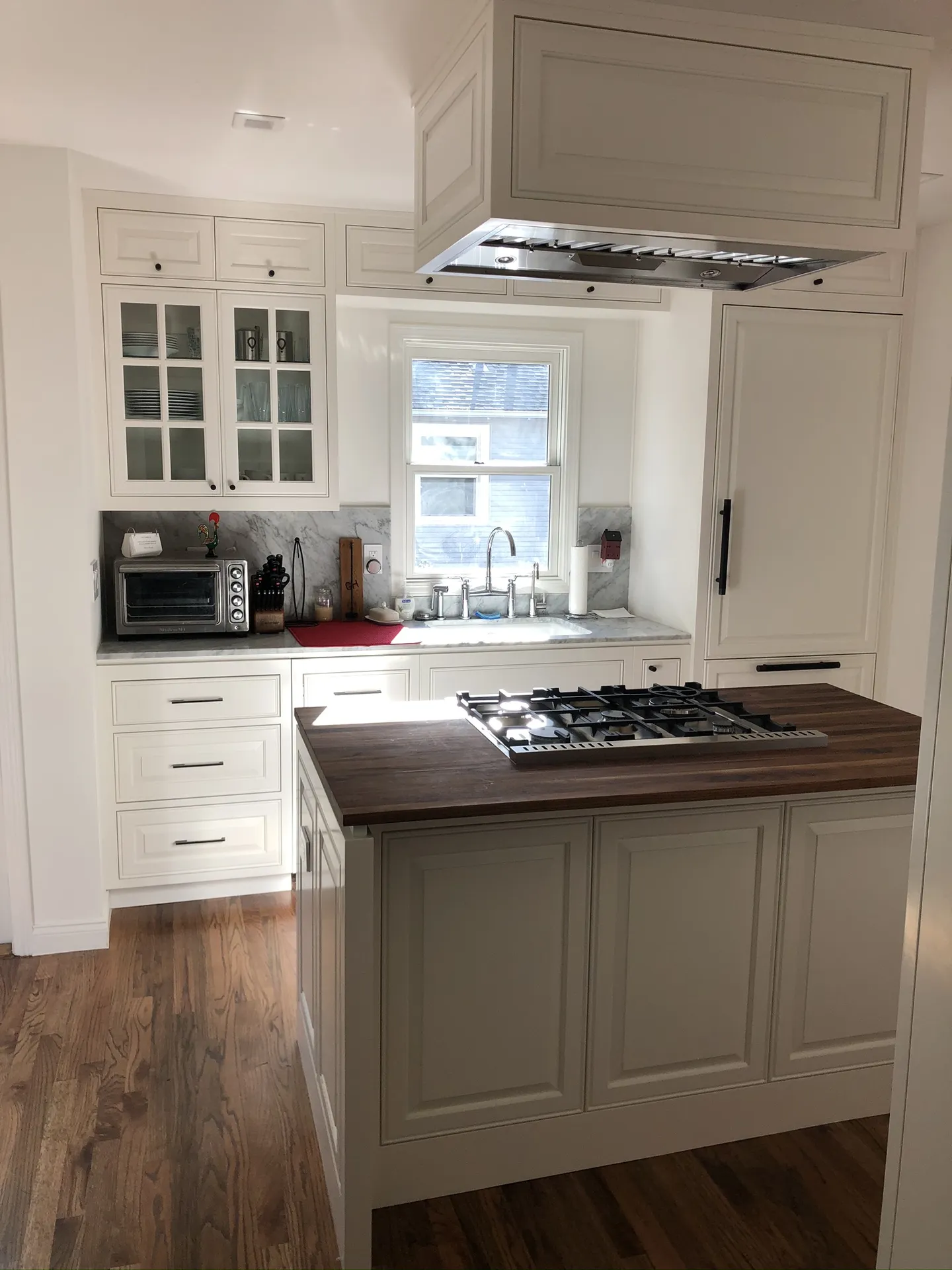 Stainless Hood and Marble Island Kitchen