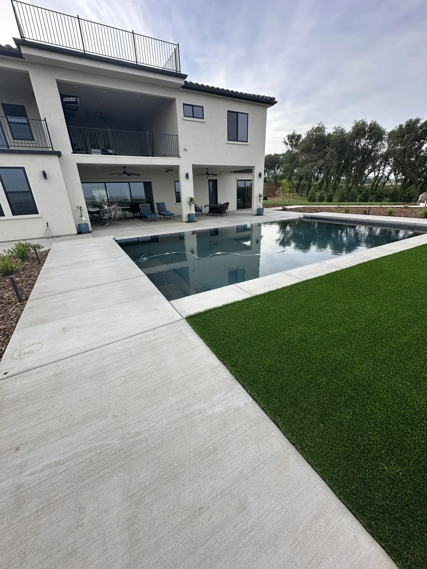 Concrete Deck and Turf Lawn