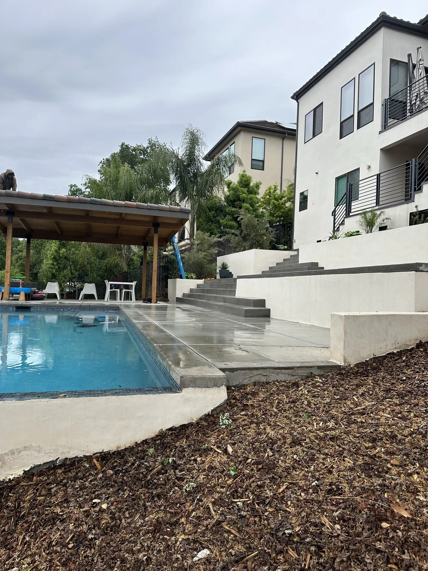 Pool Tiered Steps With Pergola Seating