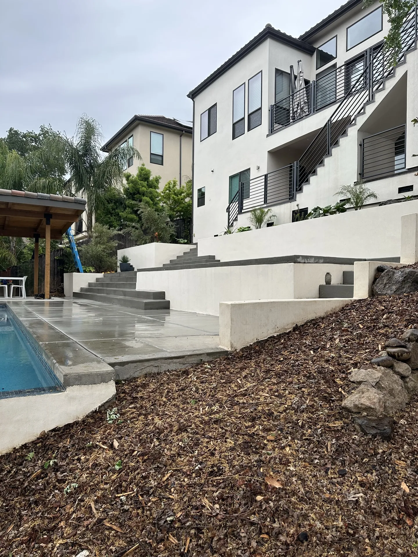 Tiered Pool Patio With Pergola